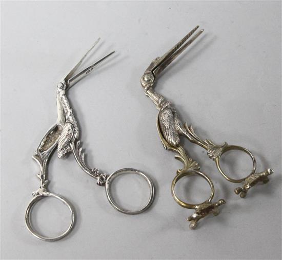 A late Victorian silver ribbon threader modelled as a stork, London, 1893 and a similar 800 standard silver threader,